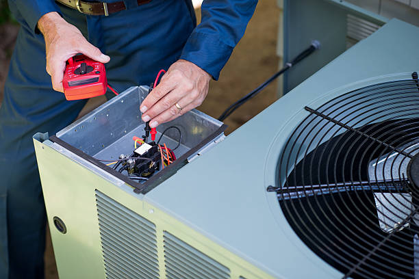 Tampa AC repair technician servicing air conditioning unit