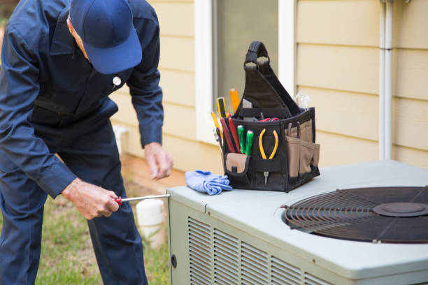 Tampa Bay HVAC expert servicing AC unit in Florida heat
